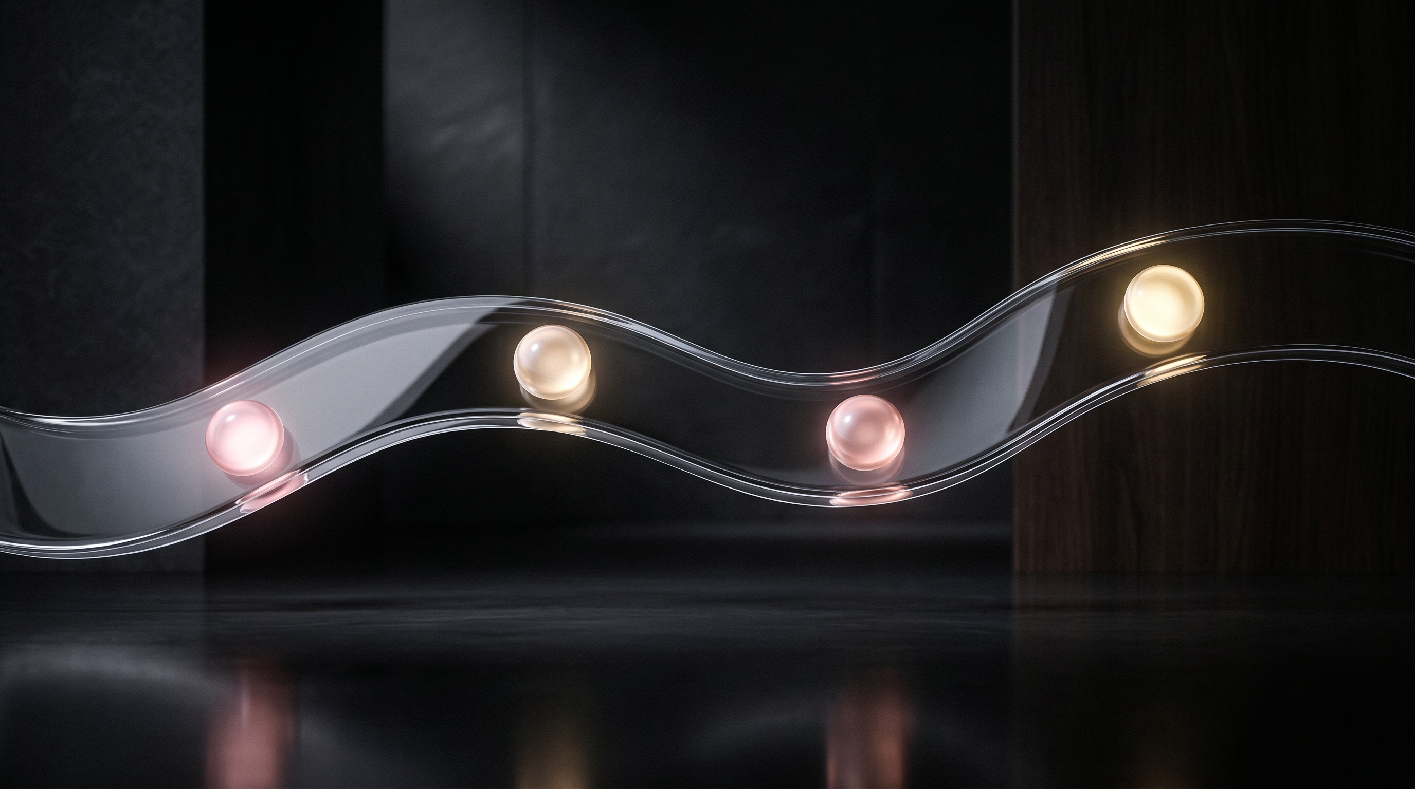 VANTUM process flow — wave-like transparent glass track carrying four glowing dusty-rose to champagne-gold spheres